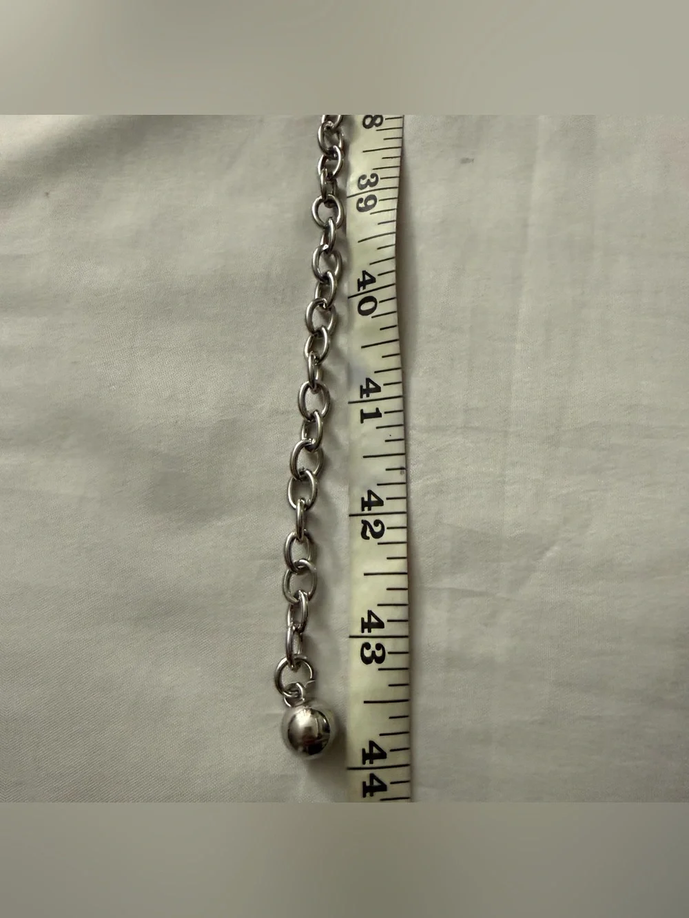 Silver tone metal chain belt with rhinestone details